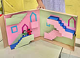 Pop-up stairs maze craft by a child, age 8, from our children holiday art class